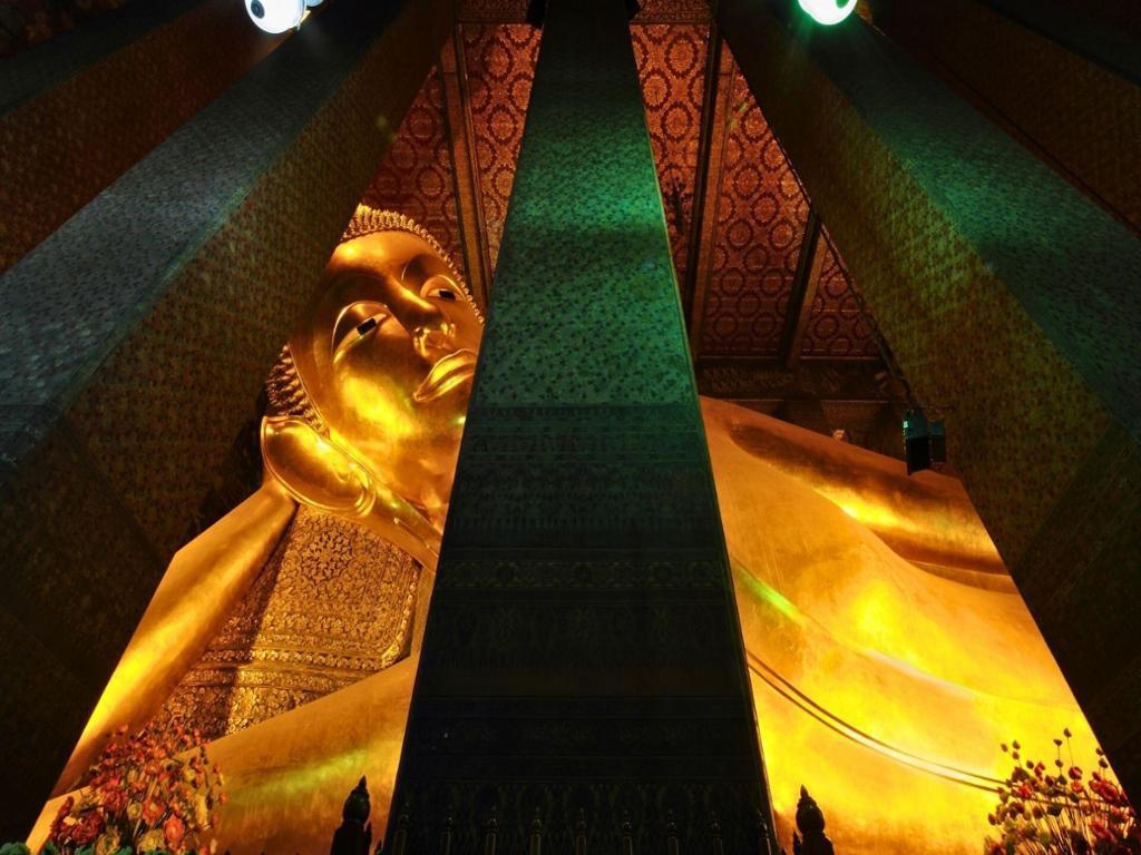 Bangkok Wat Pho Reclining Buddha with Wat Arun View at Dusk